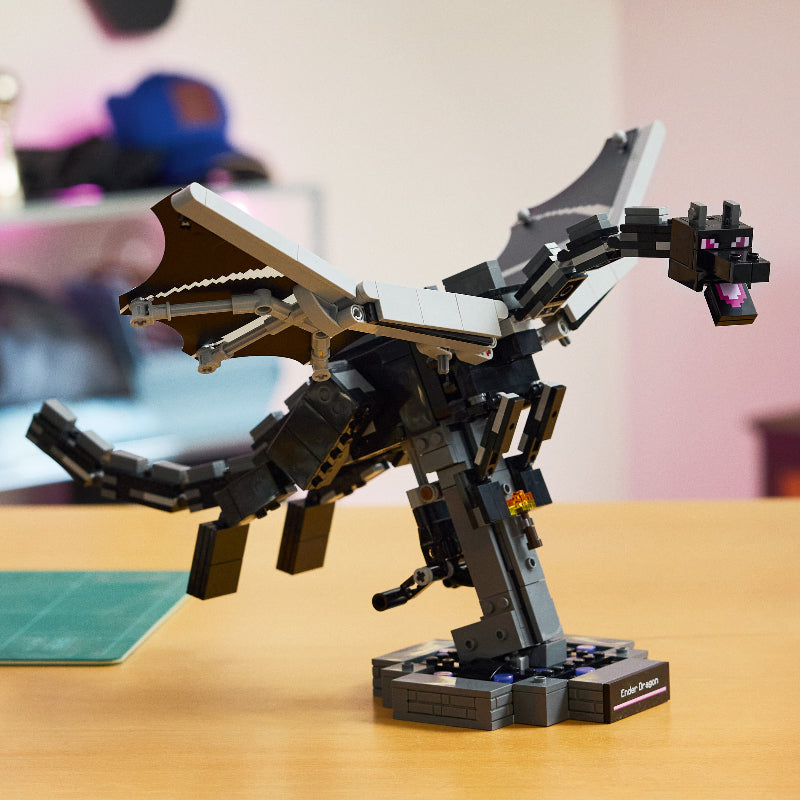 Toy dinosaur model on a wooden table with a blurred background