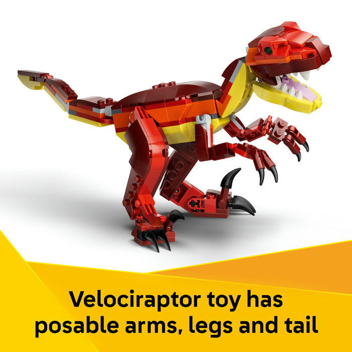 Red velociraptor toy with movable arms, legs, and tail on a white background