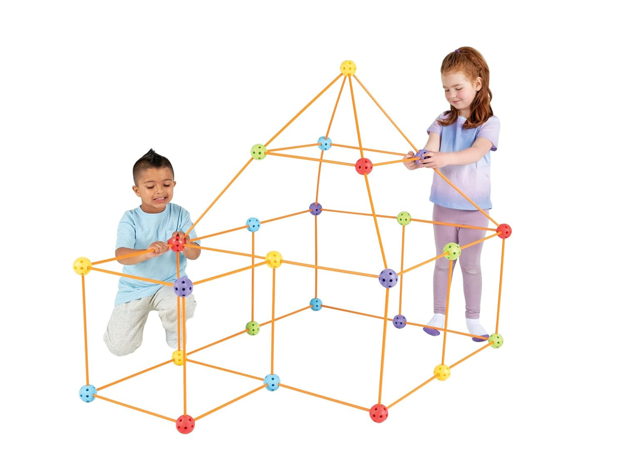 Two children playing with a geometric structure made of colorful interlocking bricks on a white background.