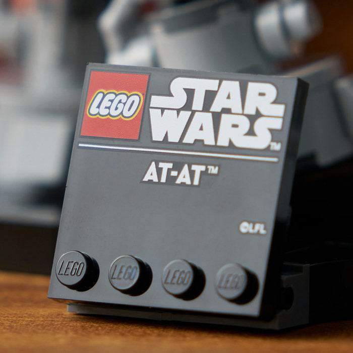 LEGO Star Wars AT-AT model on a wooden surface with a blurred background