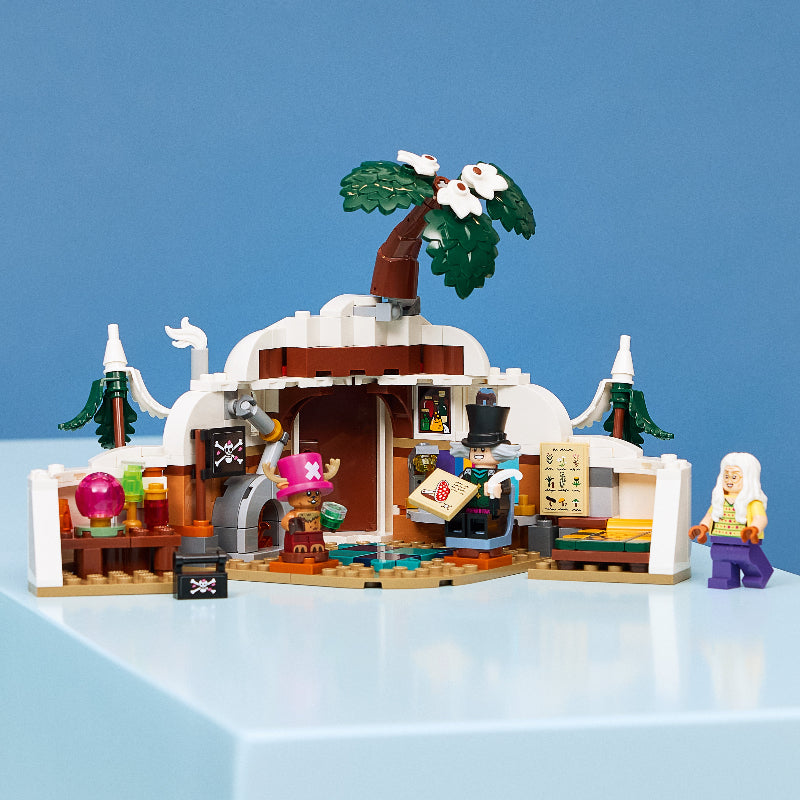 LEGO pirate ship model with characters on a blue background