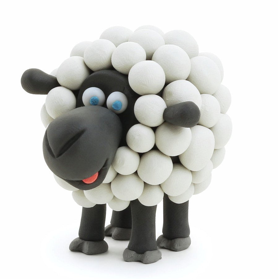 Sheep figurine made of white and black balloons on a white background
