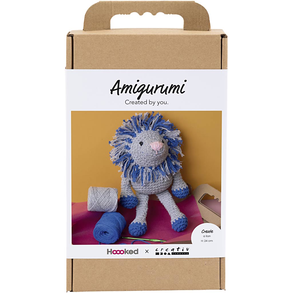 Amigurumi lion toy packaging with 'Amigurumi Created by you' text on a white background