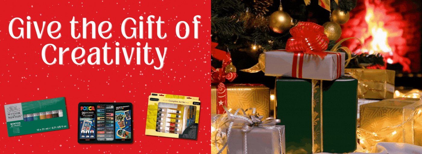 presents under a Christmas tree in front of a fire with 3 art sets and the text "give the gift of creativity"