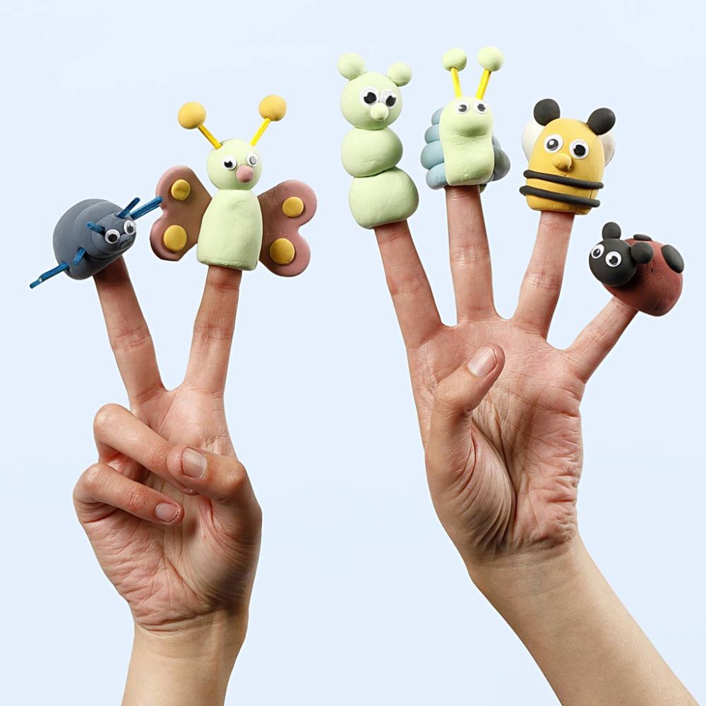 two hands with clay finger puppets in the shape of insects on 6 fingers on a white background