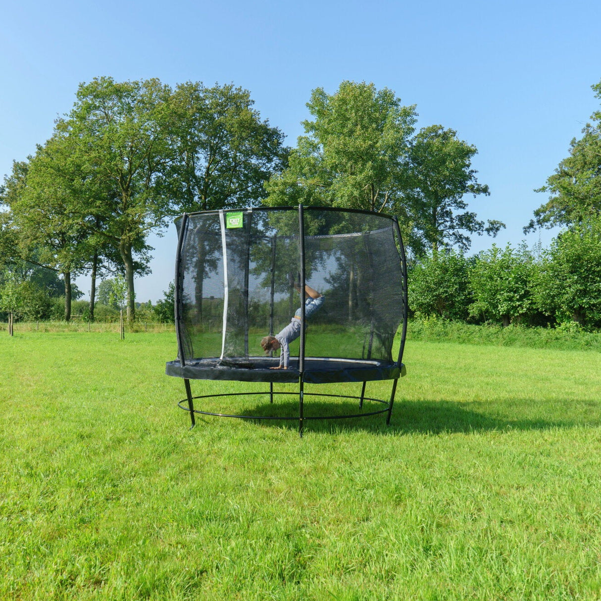 Exit Lotus Classic Round Trampoline with Safety Net in the garden