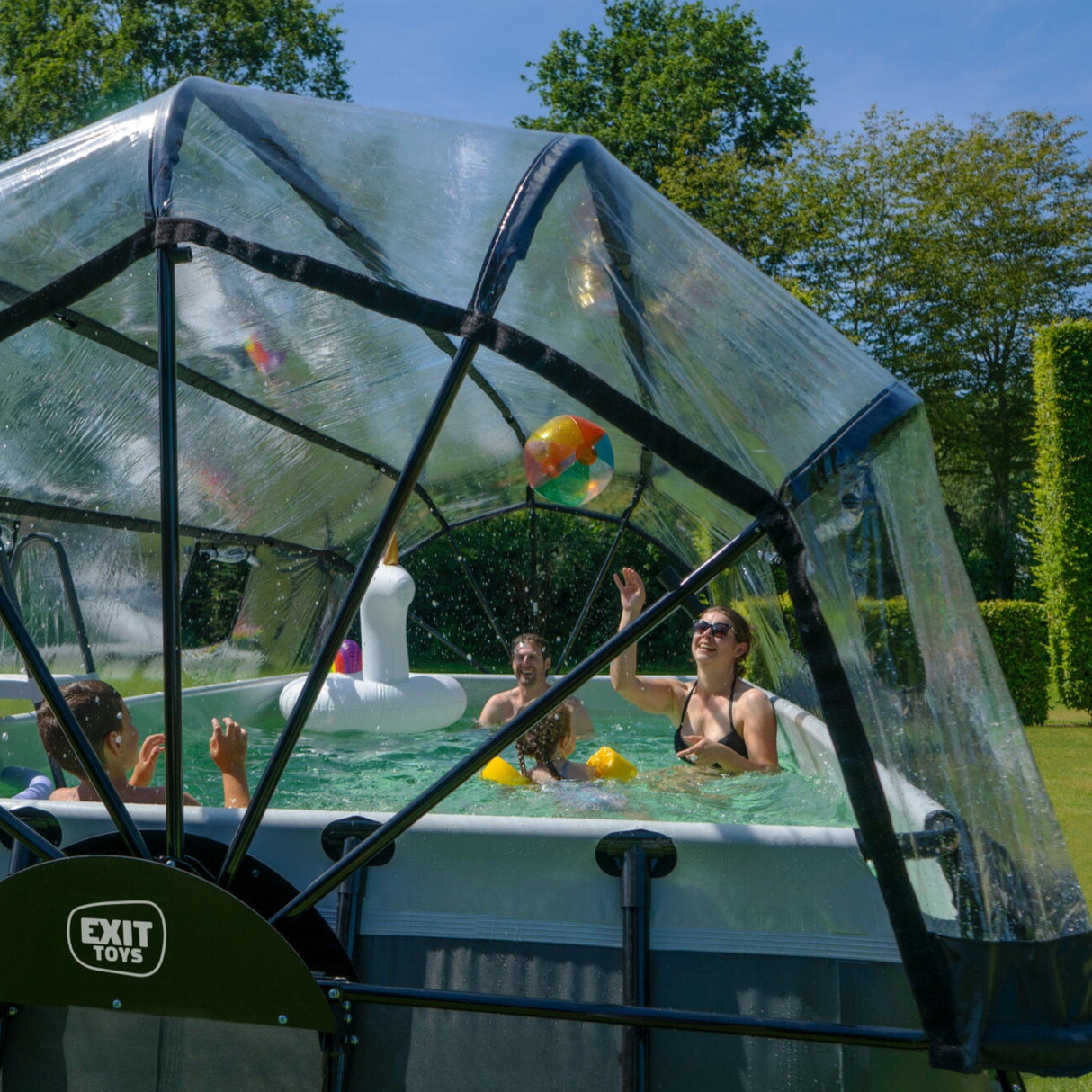 People playing in an Exit Toys black leather outdoor pool