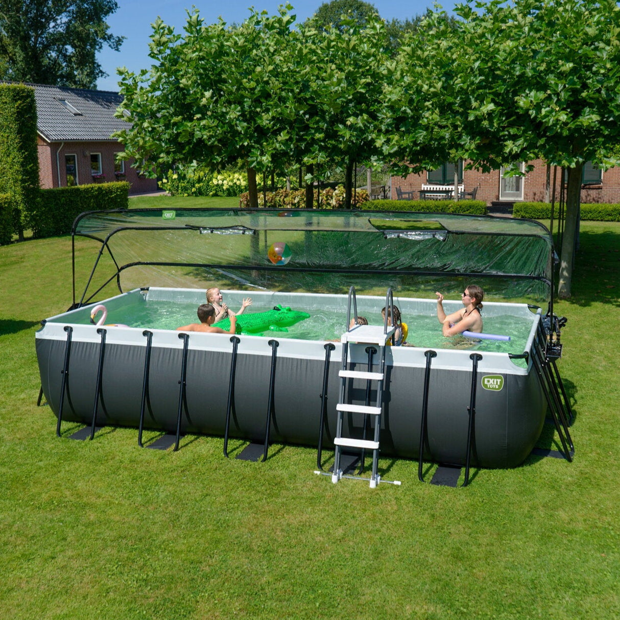 EXIT Toys Black leather rectangular pool outside in the sun