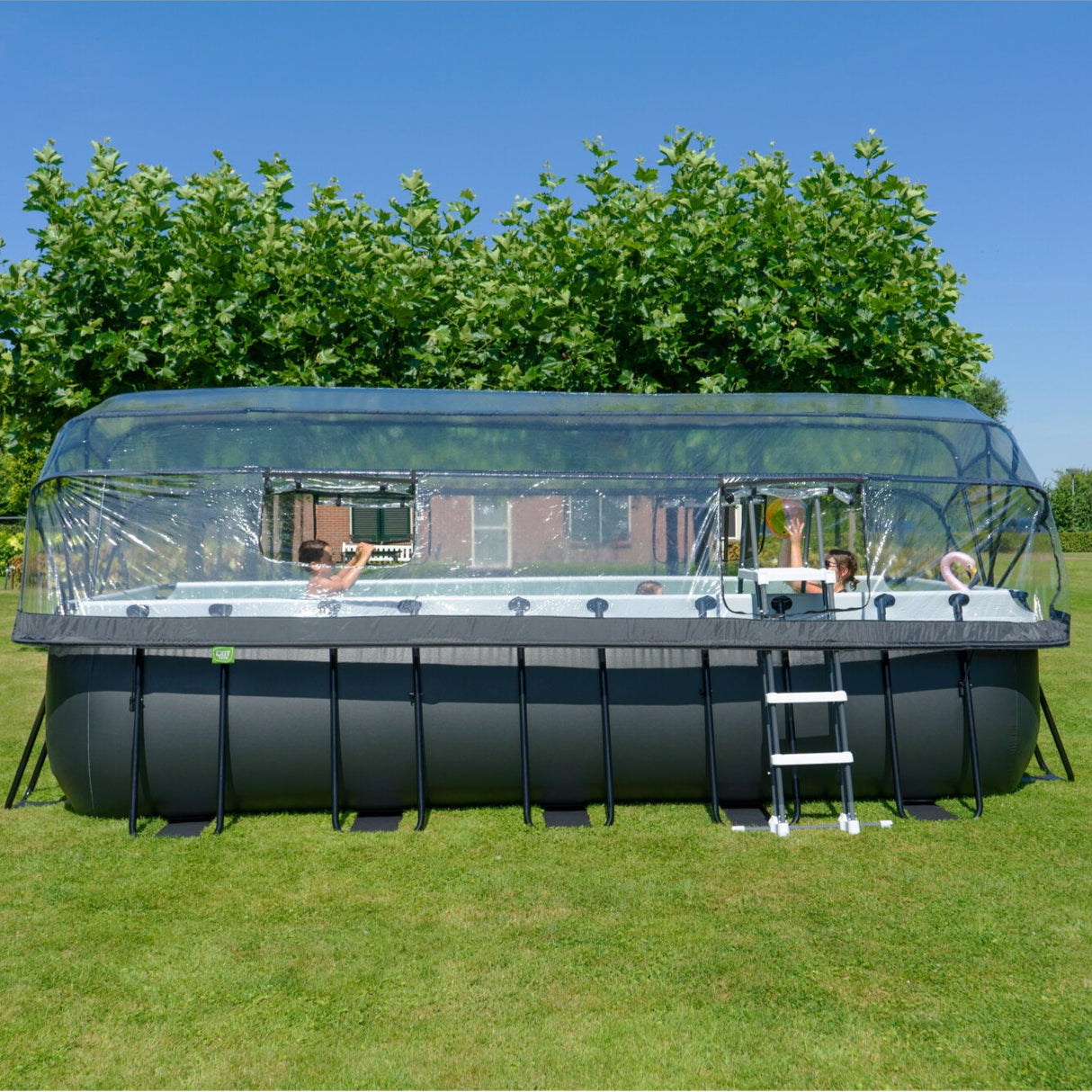 EXIT Toys Black leather rectangular pool outside in the sun