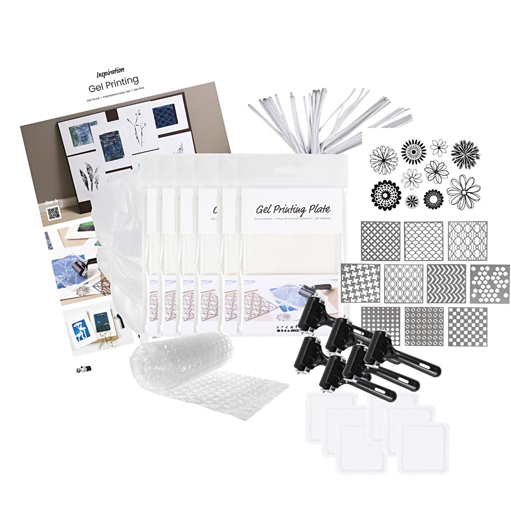 Gel printing kit with plates, stencils, and tools on a white background