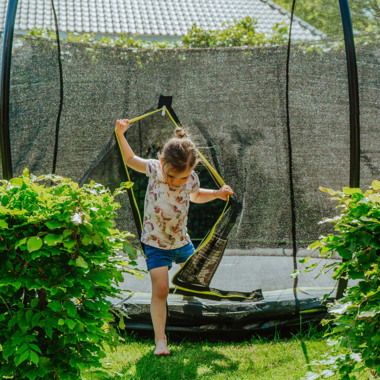 Girl coming out of Exit Silhouette Ground Round Trampoline