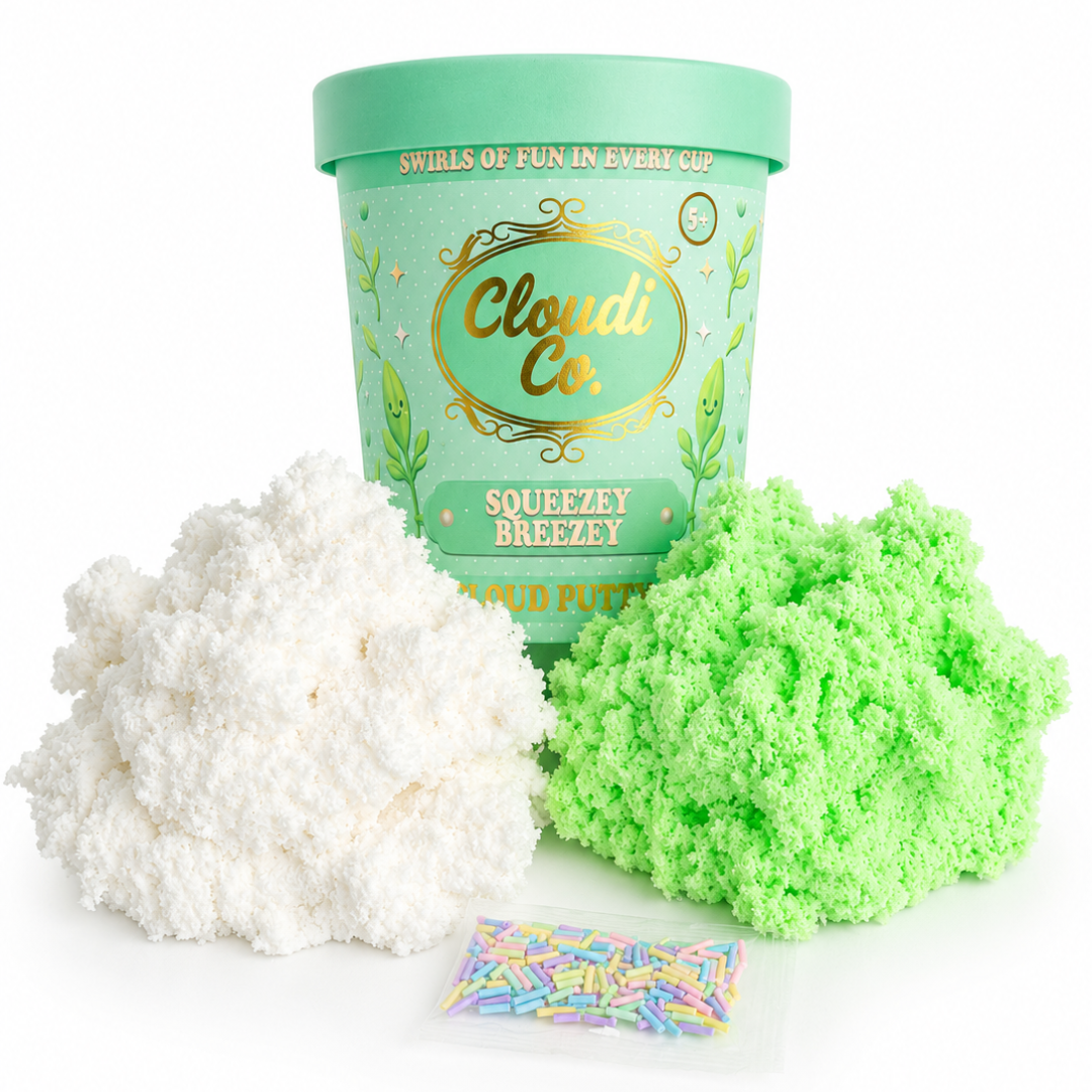 A tub of Cloud Co. Squeezzy Breezy slime with a mint green lid and label, shown with a large pile of white slime, a large pile of neon green slime, and a small packet of multicolor sprinkles on a white background.
