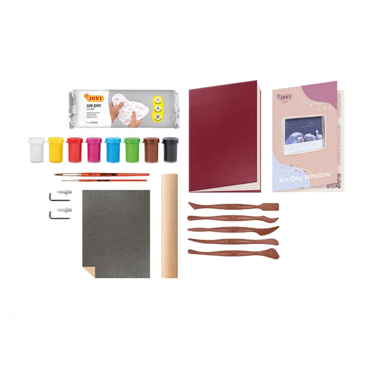 Craft set with paints, brushes, and other tools on a white background