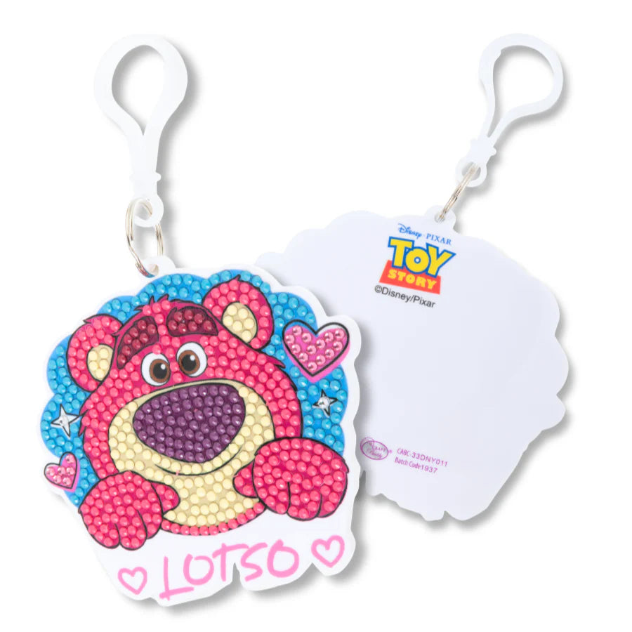 Keychain with a colorful bear design and 'Toy Story' branding on a white background