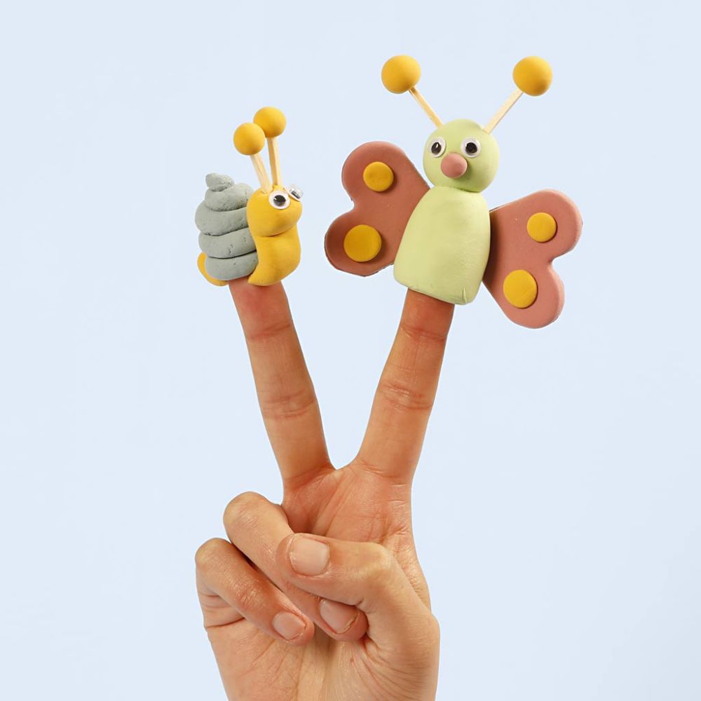 Finger puppets shaped like a butterfly and a caterpillar on a plain background