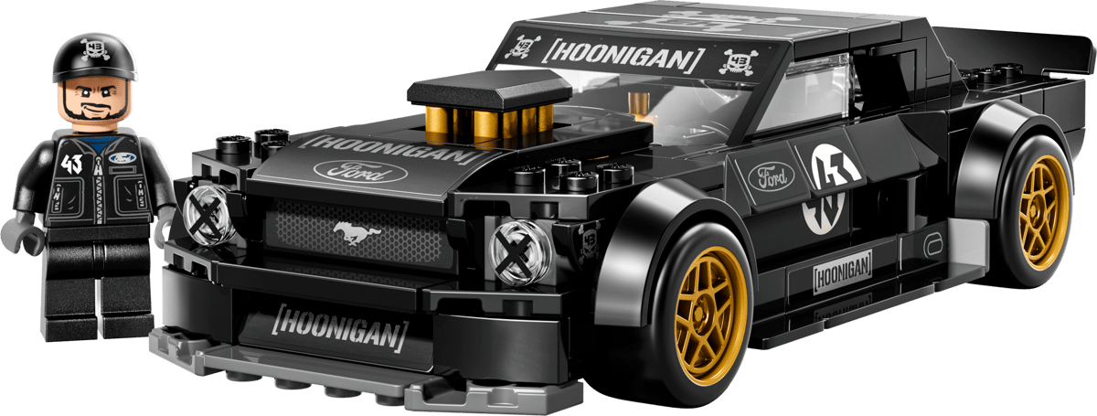 Toy model of a black and yellow car with 'Hoonigan' branding, accompanied by a driver figure.