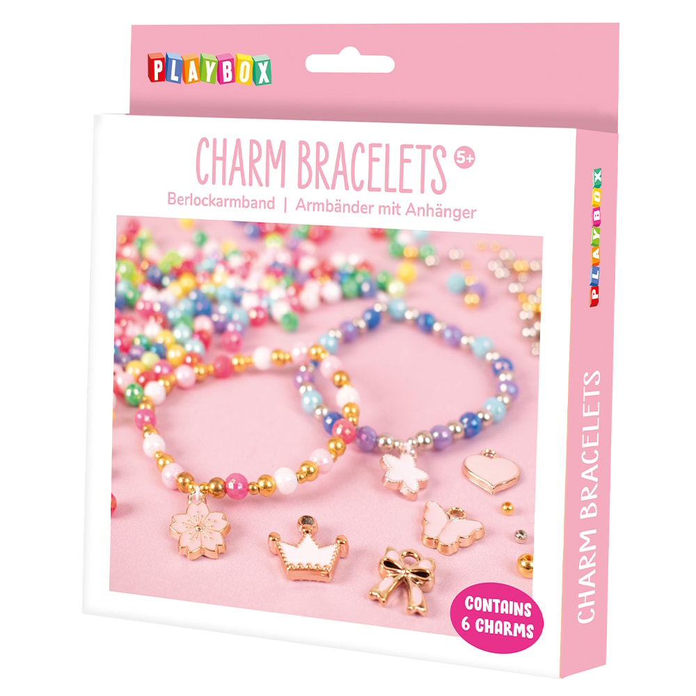 Packaged charm bracelets with colorful beads and charms on a pink background, featuring the brand 'Playbox'.