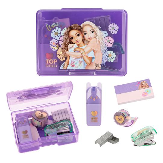 Purple stationery set with a top model tin and various items on a white background