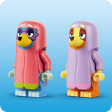 Two colorful LEGO-like figures with pink and purple outfits on a blue background