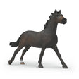 Dark brown horse figurine on a white background