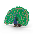 Toy peacock figure with extended tail on a white background