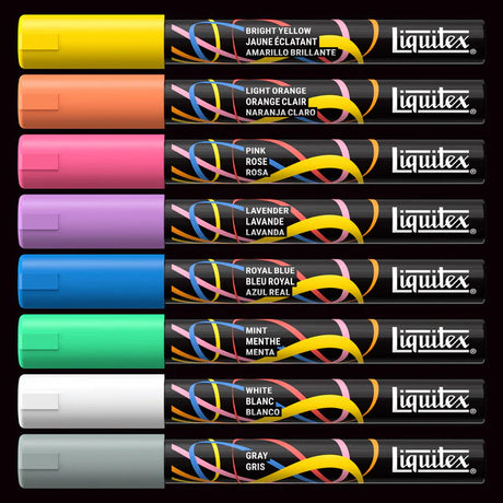 Set of Liquitex paint markers in various colors on a black background