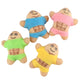 Four small plush toy figures with cartoon faces and muscular abdomens, each wearing different bright shirts and shorts: green, blue, pink, and yellow, arranged on a plain white background.