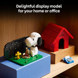 Snoopy and Woodstock display model with a red doghouse on a shelf.