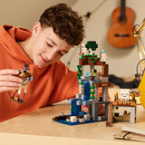 Child playing with a LEGO set on a table, with a guitar in the background.