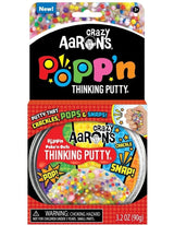 Crazy Aaron's Popp'n Thinking Putty packaging with colorful text and images.