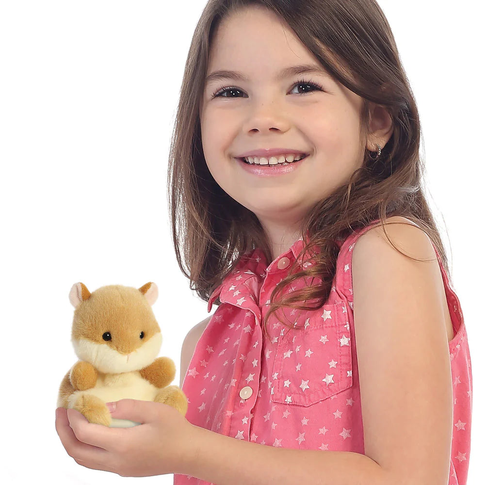 Young girl holding a plush toy with a white background