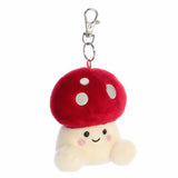 Plush mushroom keychain with a smiling face on a white background