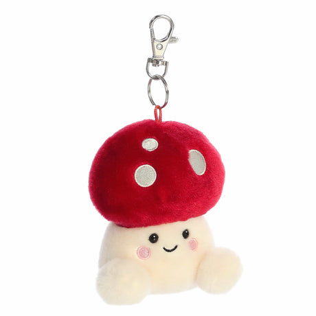 Plush mushroom keychain with a smiling face on a white background