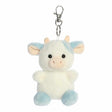 Plush cow keychain with a white and blue color scheme on a white background