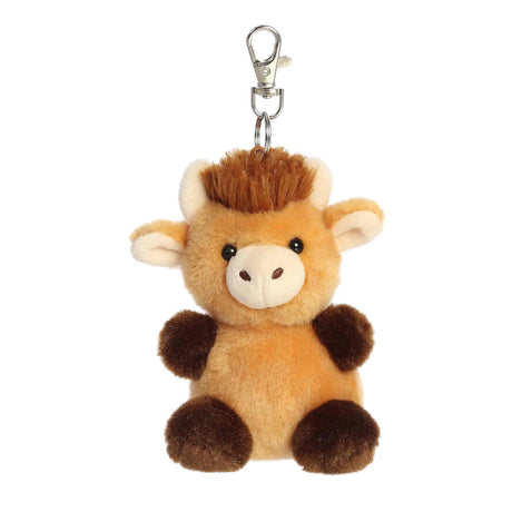 Plush cow keychain with a white background