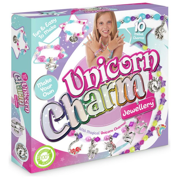 Unicorn Charm Jewellery craft kit box featuring a smiling girl on the front, with colorful unicorn charms and bead strands illustrated on the packaging.