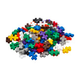 Colorful assortment of small interlocking bricks on a white background