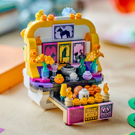 Colorful toy set resembling a small store or cafe with various items on a wooden surface.