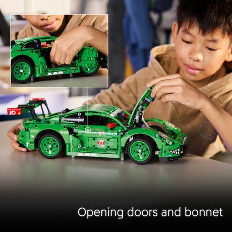 Child playing with a green toy car, focusing on opening doors and bonnet.