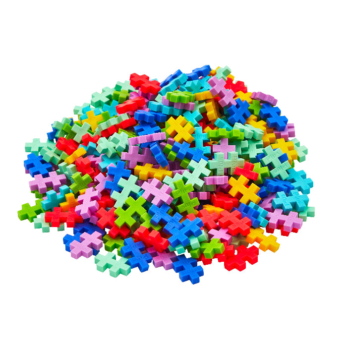 Colorful cross-shaped building blocks on a white background