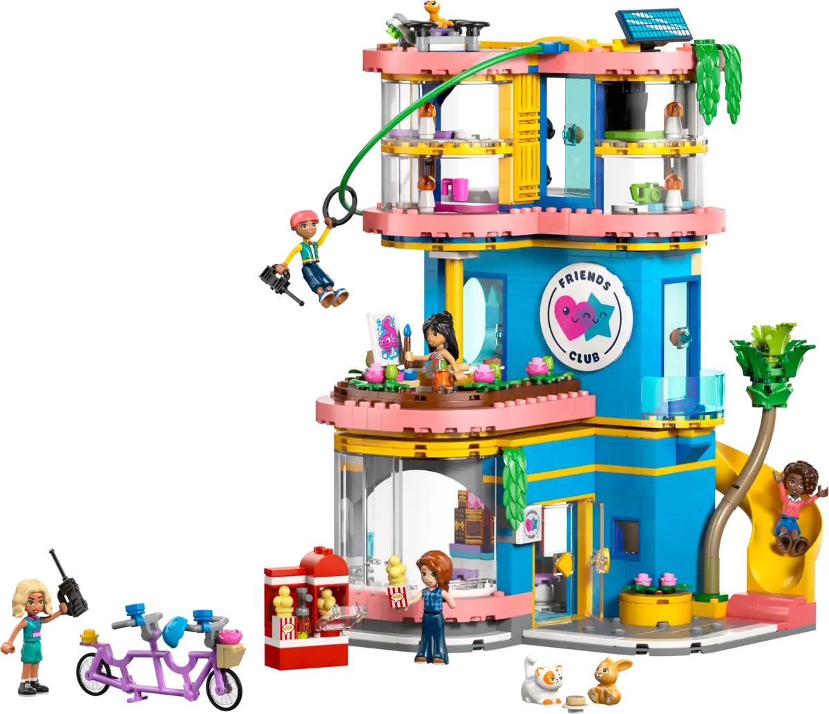 LEGO Friends toy set with a multi-story building, characters, and accessories on a white background