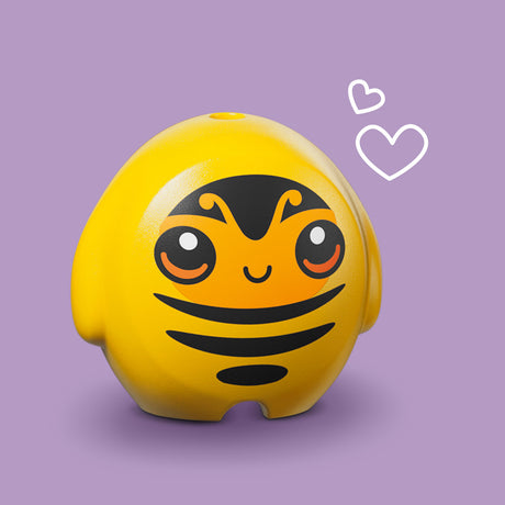 Yellow bee-shaped container with a smiling face on a purple background