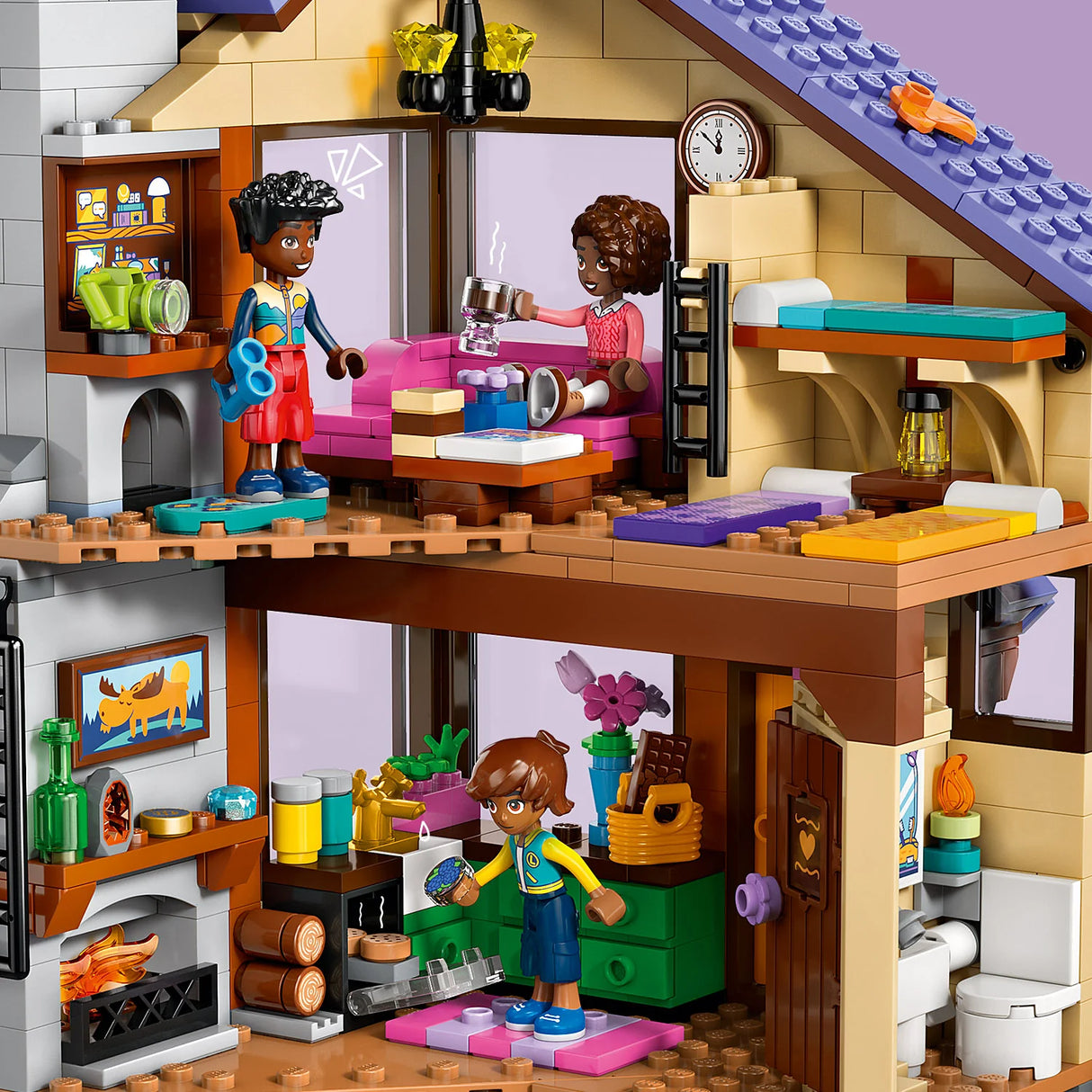 Toy house with a living room and kitchen area, featuring LEGO figures and furniture.