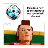 Soccer ball with co-molded face design and LEGO figure head on a white background