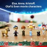Toy figures of Elsa, Anna, Kristoff, Olaf, and Sven on a wooden surface with a festive background.