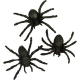 Three black spider toys on a white background