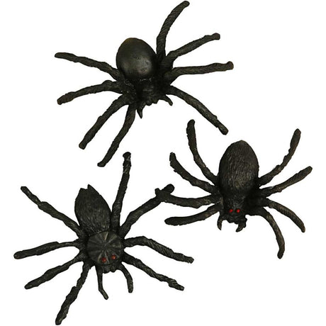 Three black spider toys on a white background