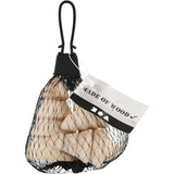 Mesh bag with wooden trees and a label indicating 'Made of Wood' on a white background