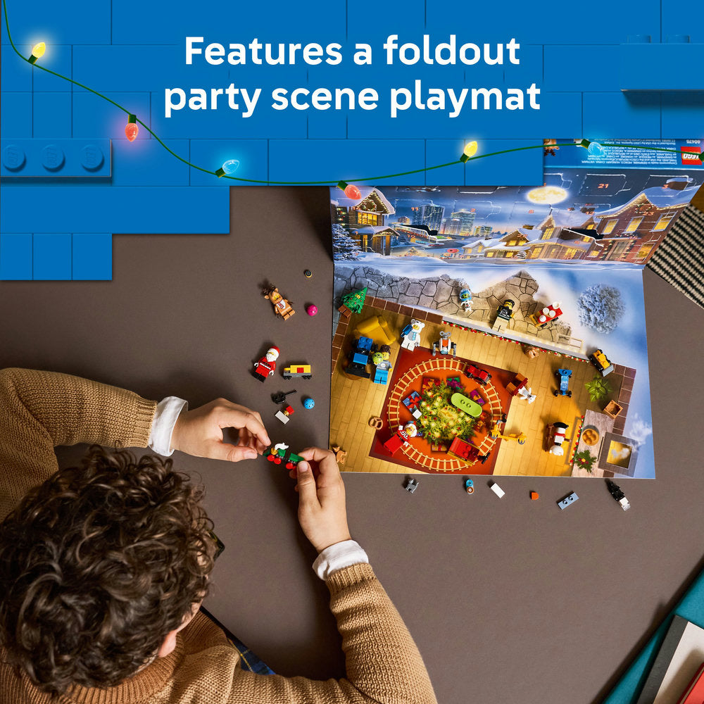 Person playing with toys on a table with a foldout party scene playmat in the background.