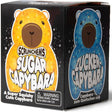 Scrunchems Sugar Capybara toy packaging box showing two bear designs on the front and side panels: a yellow-orange capybara on the left and a blue capybara on the right, with the Scrunchems brand name visible.